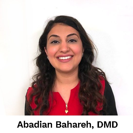 A smiling woman in a red shirt with the words abdul bahaar, dmd.