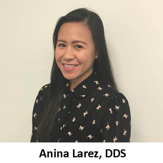 A smiling woman in a black shirt with the words annie laraz, dds.