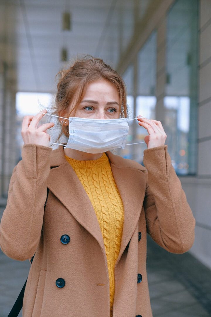 A young woman wearing a face mask.