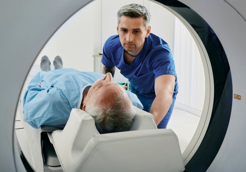 Man being prepped for MRI scan.