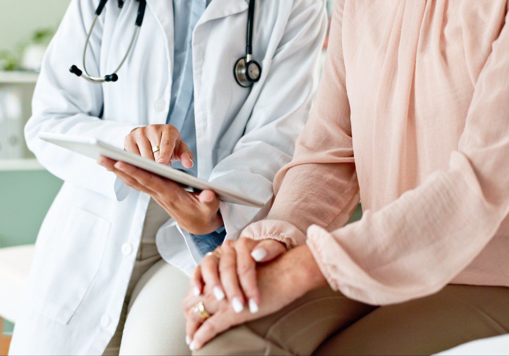 Clinic, tablet and hands of doctor with patient for consulting, medical service.