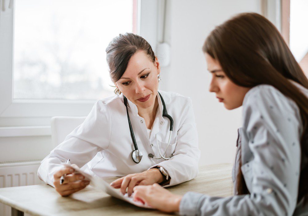 Woman receiving guidance on menstrual and hormonal health.