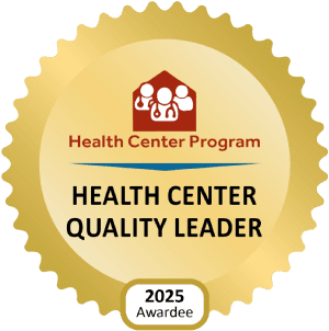 Gold badge with the Health Center Program logo, reads "Health Center Quality Leader," and displays "2025 Awardee" at the bottom.
