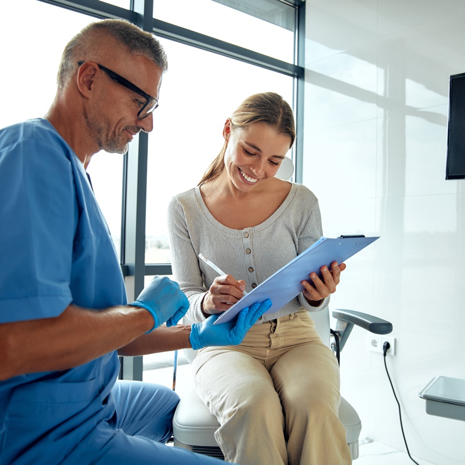 In modern medicine, a healthcare professional discusses treatment options with a patient, emphasizing the importance of patient care and effective communication throughout the process