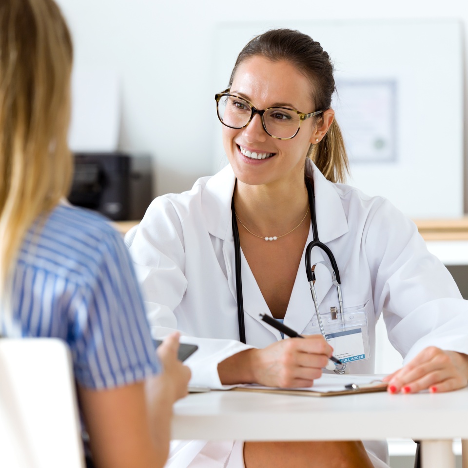 Portrait of female doctor explaining diagnosis to her patient.