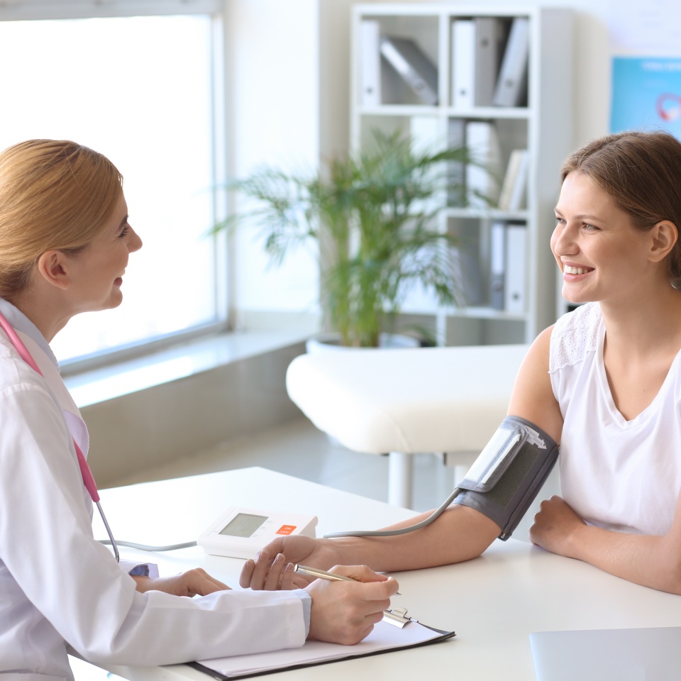 Young woman visiting her gynecologist in clinic