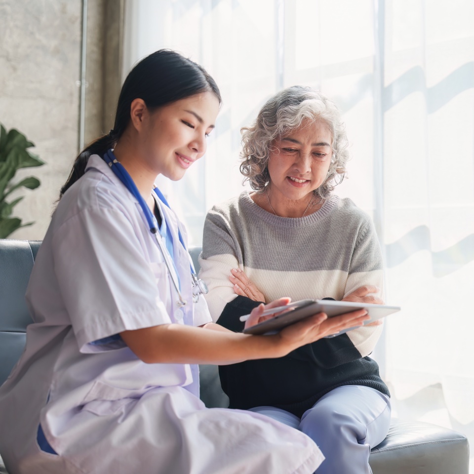 Home healthcare nurse, physical therapy with senior adult woman at home.
