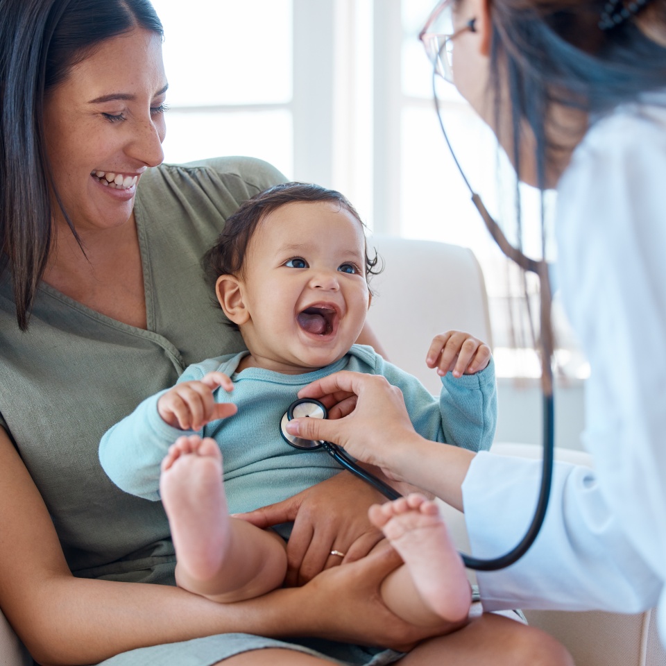 Mother, baby and stethoscope of pediatrician for healthcare consulting, check lungs and breathing for heartbeat. Doctor, happy infant kid and chest assessment in clinic, hospital and medical analysis.