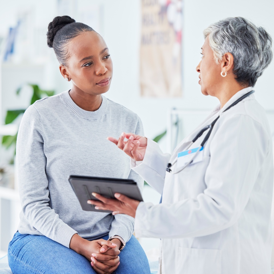 Doctor, woman and tablet for hospital, healthcare advice and support for results, exam and test on bed. Senior expert or medical people on digital tech for clinic sign up, registration and consulting.