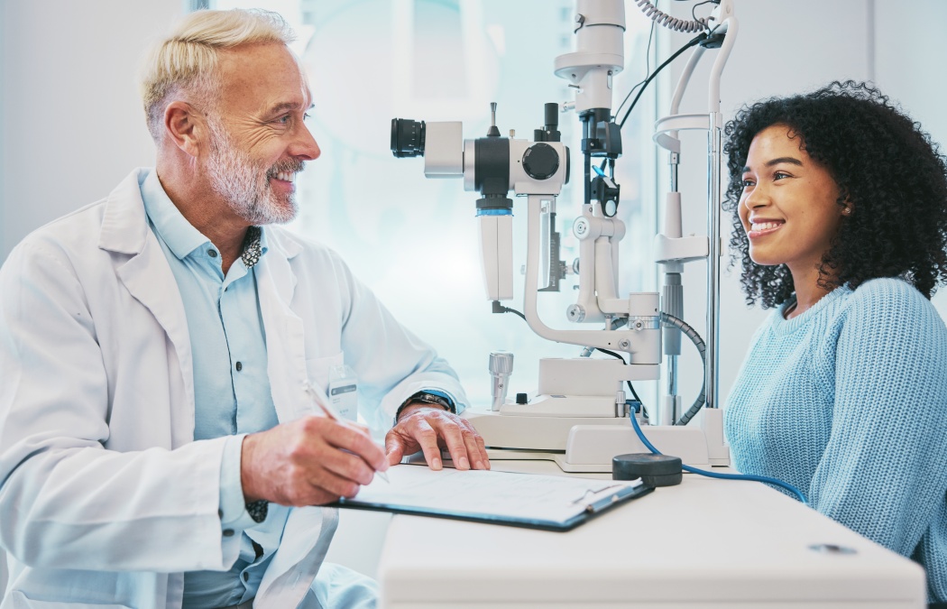 Eye exam, consulting and smile with doctor and black woman for healthcare, ophthalmology and medical. Glaucoma, laser and wellness with patient and optometrist in clinic for vision, checklist or help.