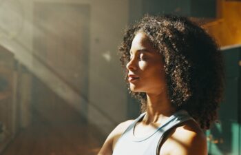 Calm woman, relax and sunlight with meditation at home for zen, awareness or mindfulness. Female person, yogi or balance with inner peace for stress relief, breathing exercise or wellness at house.