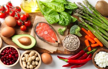Many different healthy food on white table, flat lay